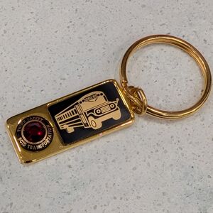Gold Tone School Bus Keychain with Red Gem Accent